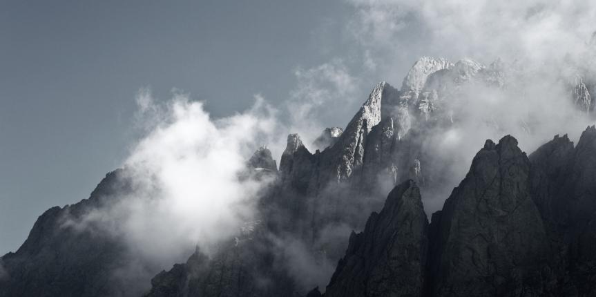 Impressive high mountain view – mountain peaks in mist
